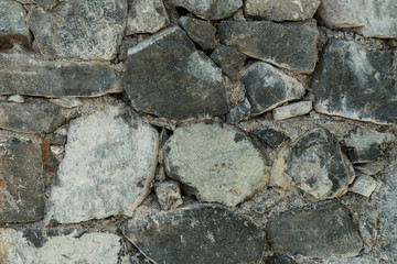 Granite texture, stone wall surface closeup