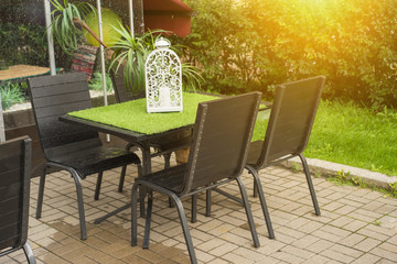 A tables and many chairs on a terrace