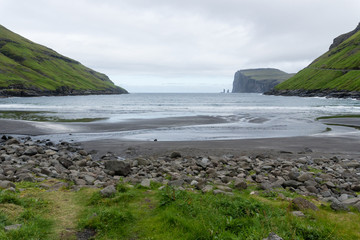 Fototapeta na wymiar Risin and Kellingin, the giant and the witch,Eystruroy island, Faroe, view from Tjornuvik