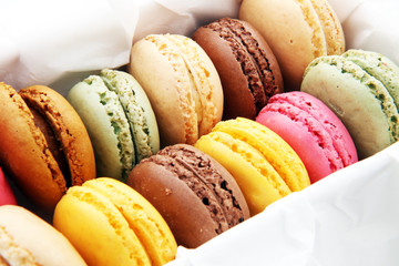 Different types of macaroons or macarons in a box.