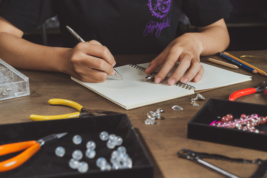 Woman making bears on rustic wooden table