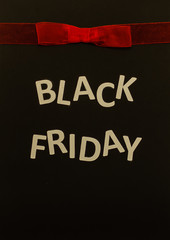 Black Friday sale banner with red bow