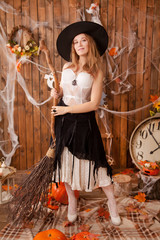 pretty erotic white lace lingerie woman on the wooden halloween party background alone