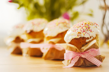 Traditional russian easter cake with  bright  decoration stand in group on the table. In background...