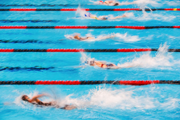 Freestyle swimming race, motion blurred image.
