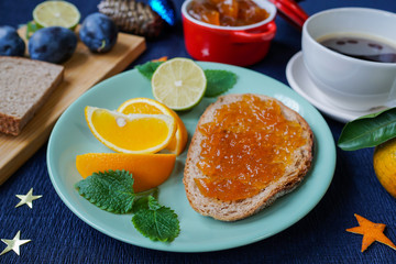 New Year's breakfast, coffee, bread, jam. Festive table setting.