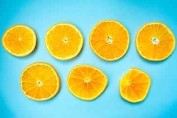 Circles of orange on a colorful blue background. Colorful background.