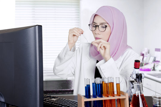 Muslim scientist doing experiment in the lab