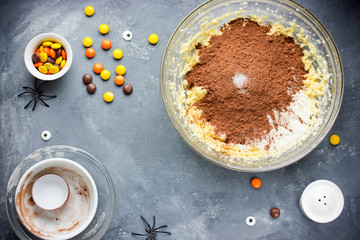 Halloween cookies with chocolate, orange and yellow candy, Halloween recipe
