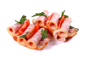 Sandwiches with rolled ham and tomatoes