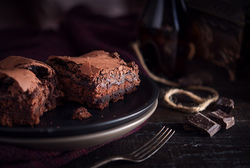 Brownie chocolate cake on dark moody background - 179464901