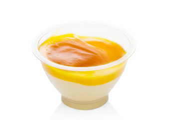 Mango dessert yogurt mousse in plastic container