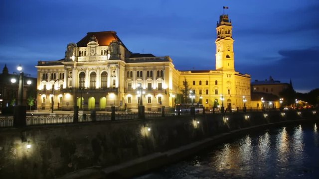 View of Oradea City Hall and river Crisul Repede in night, Romania
