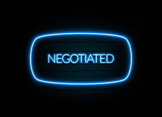 Negotiated  - colorful Neon Sign on brickwall