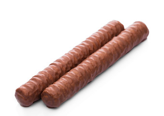 Two milk chocolate roll bars on white background