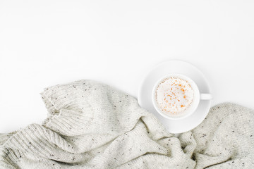 Cup of coffee  with warm plaid. Copy space. Flat lay, top view