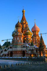 Fototapeta na wymiar Winter morning in Moscow - St. Basil's Cathedral on Red Square illuminated by the rising sun