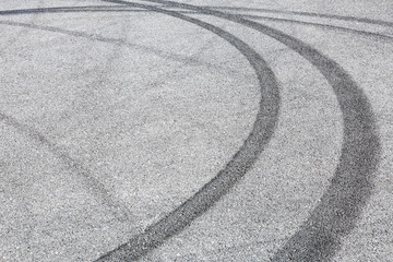 Abstract background black tire tracks skid on asphalt road,high angle shot view in racing circuit