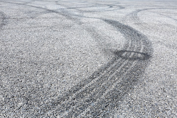 Abstract background black tire tracks skid on asphalt road,high angle shot view in racing circuit