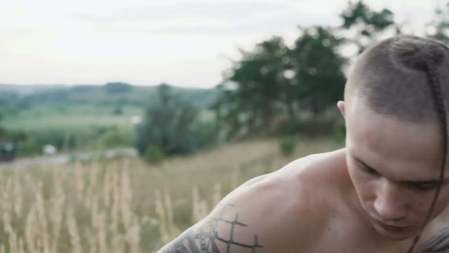Modern cossack workouts with swords in the fields 4K