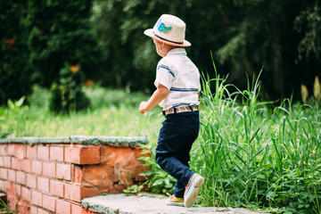 a little boy runs up the stairs