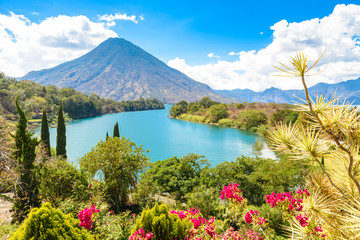 Fototapeta premium Beautiful bay of Lake Atitlan with view to Volcano San Pedro in highlands of Guatemala, Central America