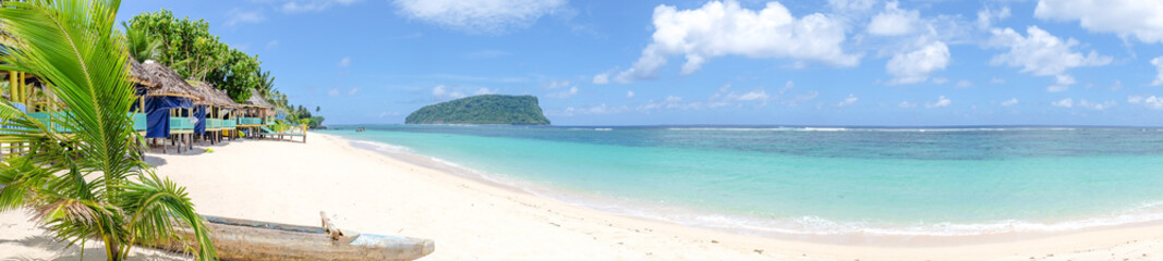 Fototapeta na wymiar Panorama of fale beach huts on Lalomanu Beach, Upolu island, Samoa, South Pacific