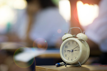 Fototapeta premium The clock is used to see the time students take exam in the classroom.
