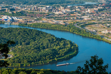 Aerial view of Chattanooga with barge on the river