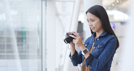 Fototapeta premium Traveler woman taking photo with camera