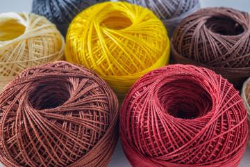 Piles of multi colored balls yarn background