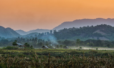 farmer hut on agricultural garden in countryside Thailand and light shines sunset