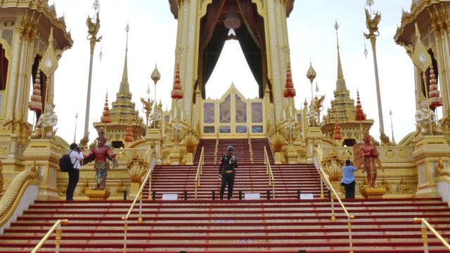 Bangkok, Thailand - October, 01 2017: Crowds of mourners to The funeral pyre tower of King Bhumibol Adulyadej. The King of Thailand at Sanam Luang Bangkok, Thailand.