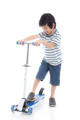 Asian boy riding a scooter on white background