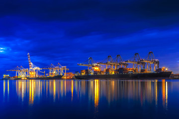 Container ship in import export and business logistic.By crane ,Trade Port , Shipping.cargo to...