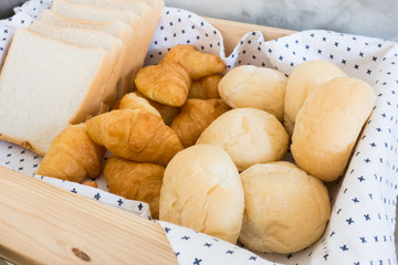 Bread in wooden basket breakfast