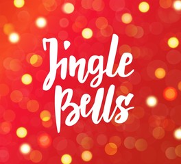 Jingle bells text, hand drawn brush lettering. Holiday greetings quote. Red sparkling glowing lights background