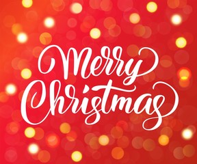 Merry Christmas text. Holiday greetings quote. Golden sparkling glowing lights. Red background with bokeh effect. 