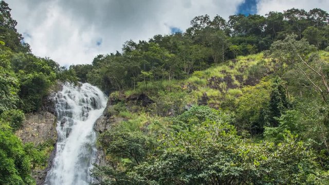 Sarika waterfall, Nakhon Nayok, Thailand. the grand waterfall in thailand with green forest and cloudy sky.
