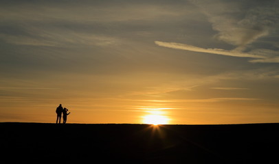 Fototapeta na wymiar Sunrise over The Cobb in Lyme Regis, Dorset