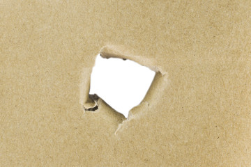  Torn hole in cardboard