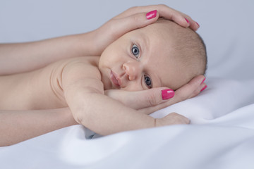 Cute newborn baby hand holding mother