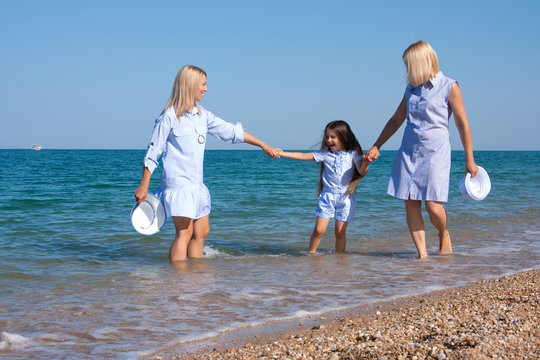 Three Generations Of Women On The Beach