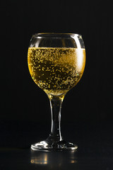 glass of champagne on black background