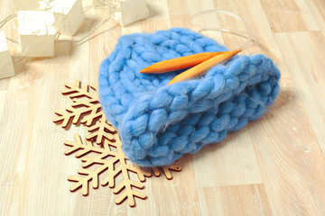 Blue knitted hat in composition