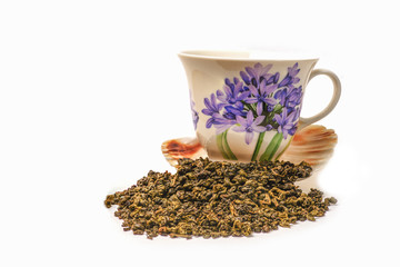 Green tea scattered on white