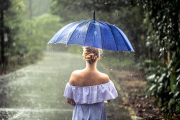girl with umbrella under the rain