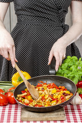 Housewife cooking mexican style dish.