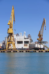 Fototapeta na wymiar port cranes in the harbour of cadiz, spain