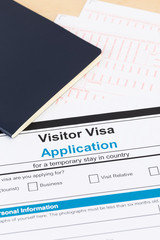 Visa application form with blue passport